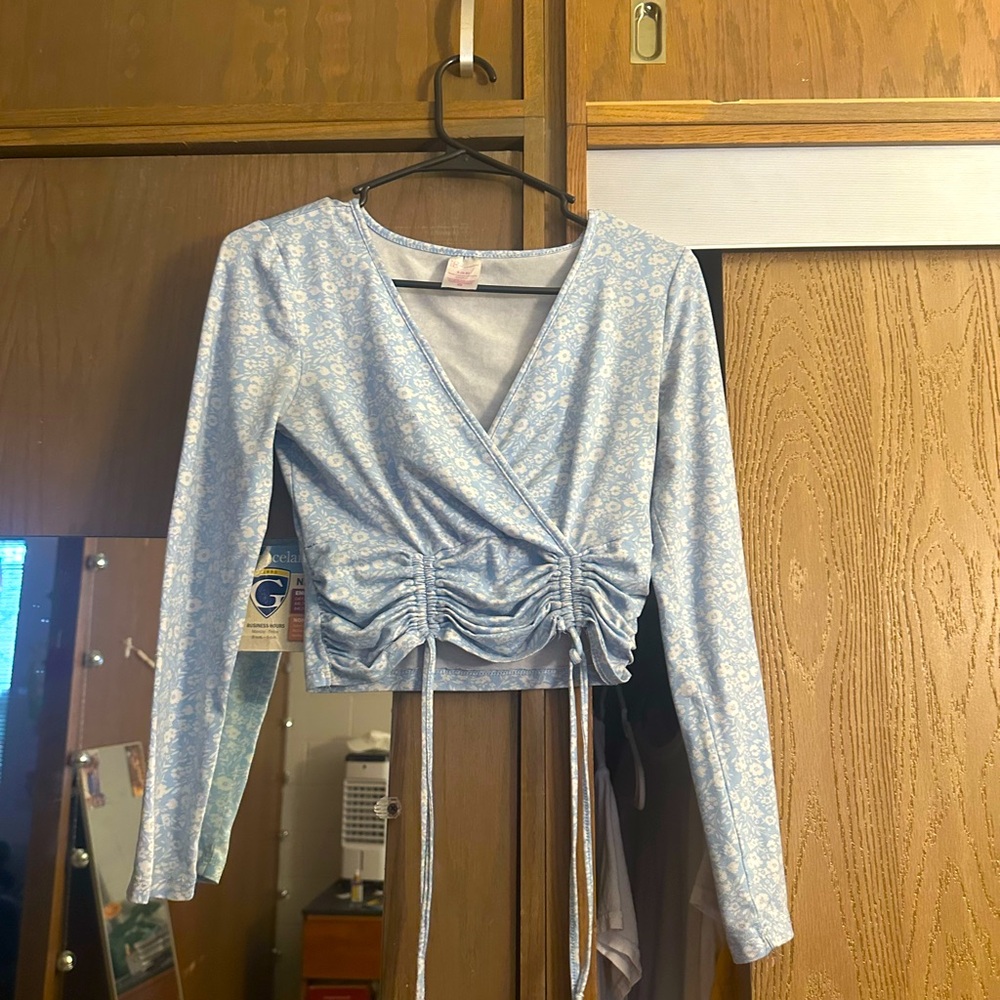 Small. Never wear it. Worn once like a year ago. Light Blue.